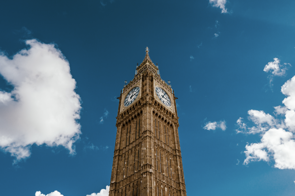 Big Ben and Elizabeth Tower overlooking the Palace of Westminster and River Thames in London, England